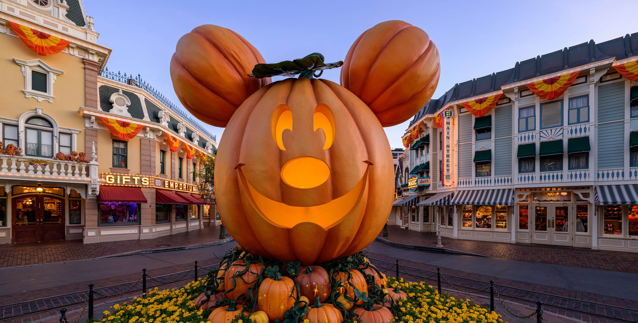 Mickey pumpkin jack-o-lantern statue at Disneyland during Halloween.