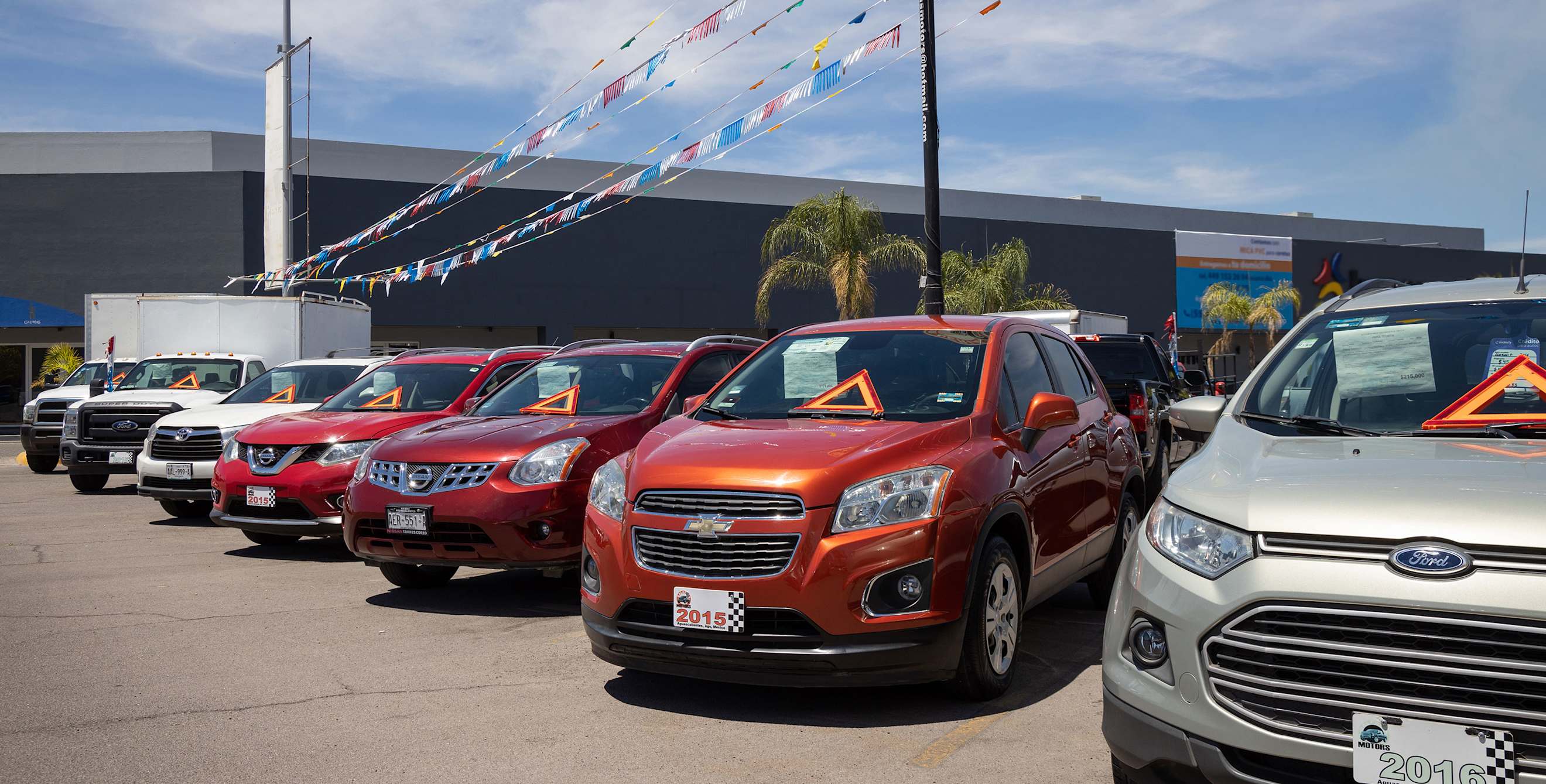 cars on the lot in a car dealership.