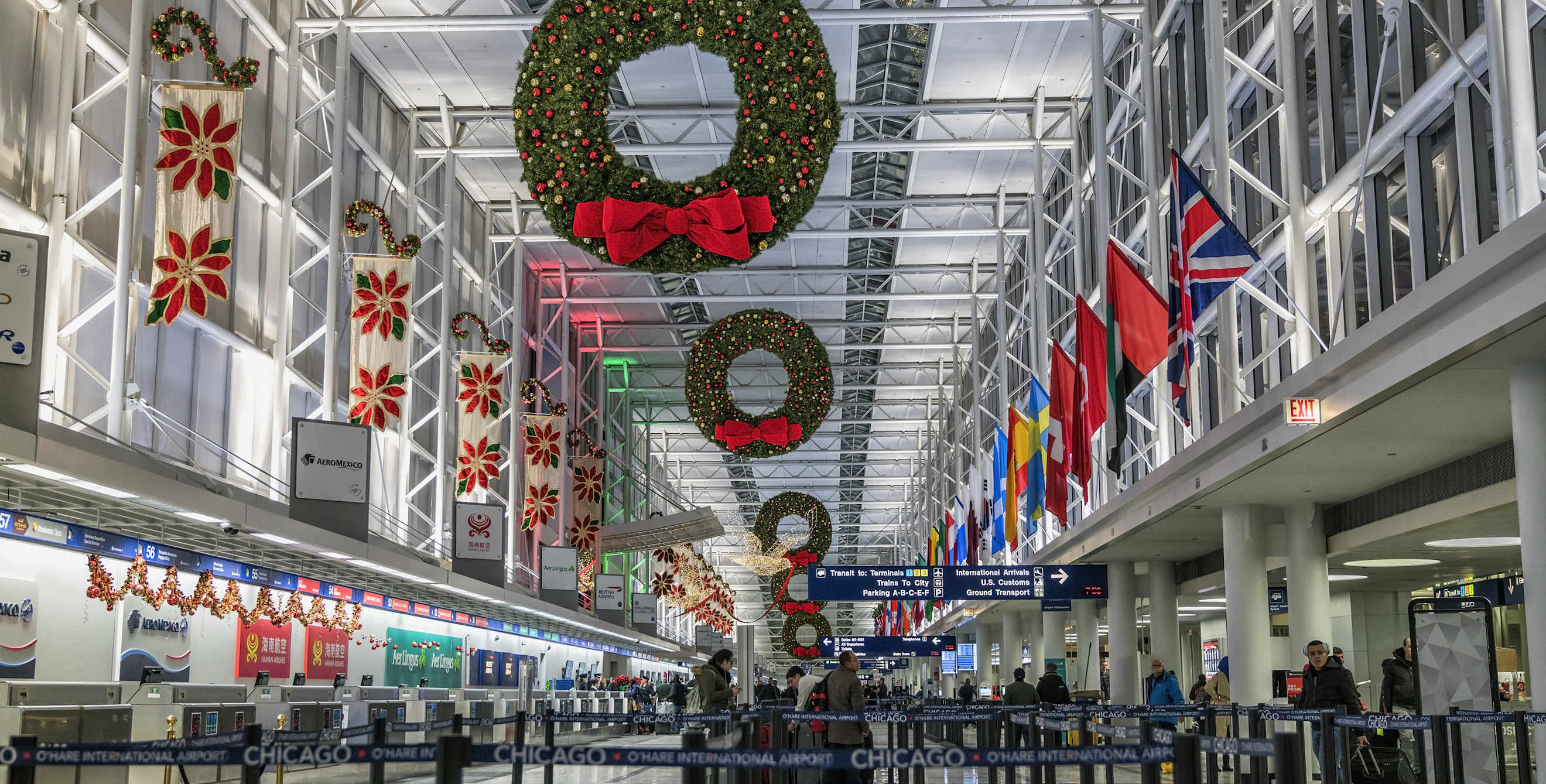 Picture of an airport terminal with passengers in line