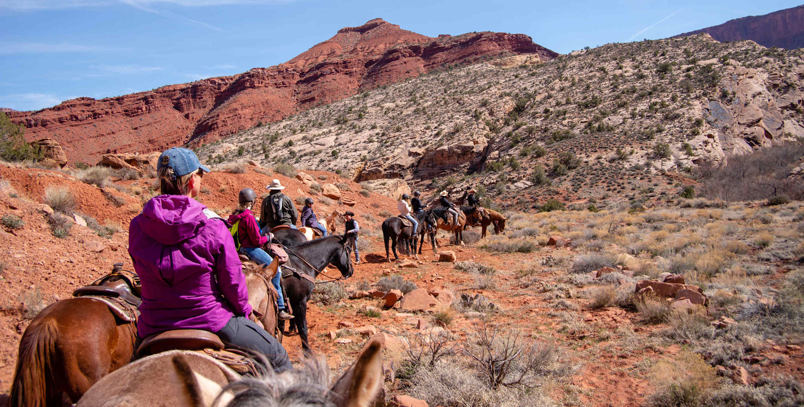 Tourists enjoy a trail ride with staff from Red Cliffs Lodge near Moab, Utah.