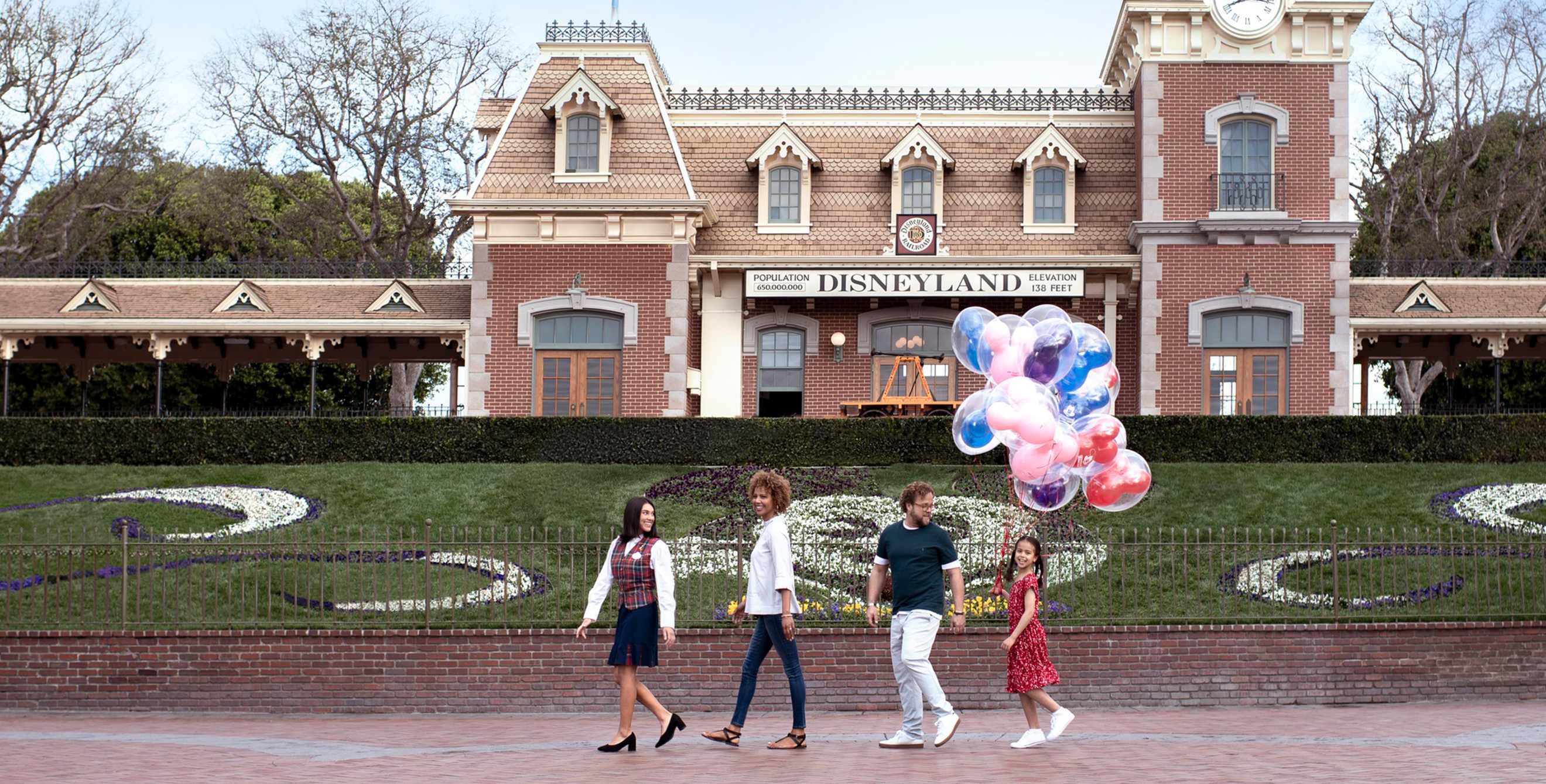A family walks through Disneyland Resort on a VIP Tour.