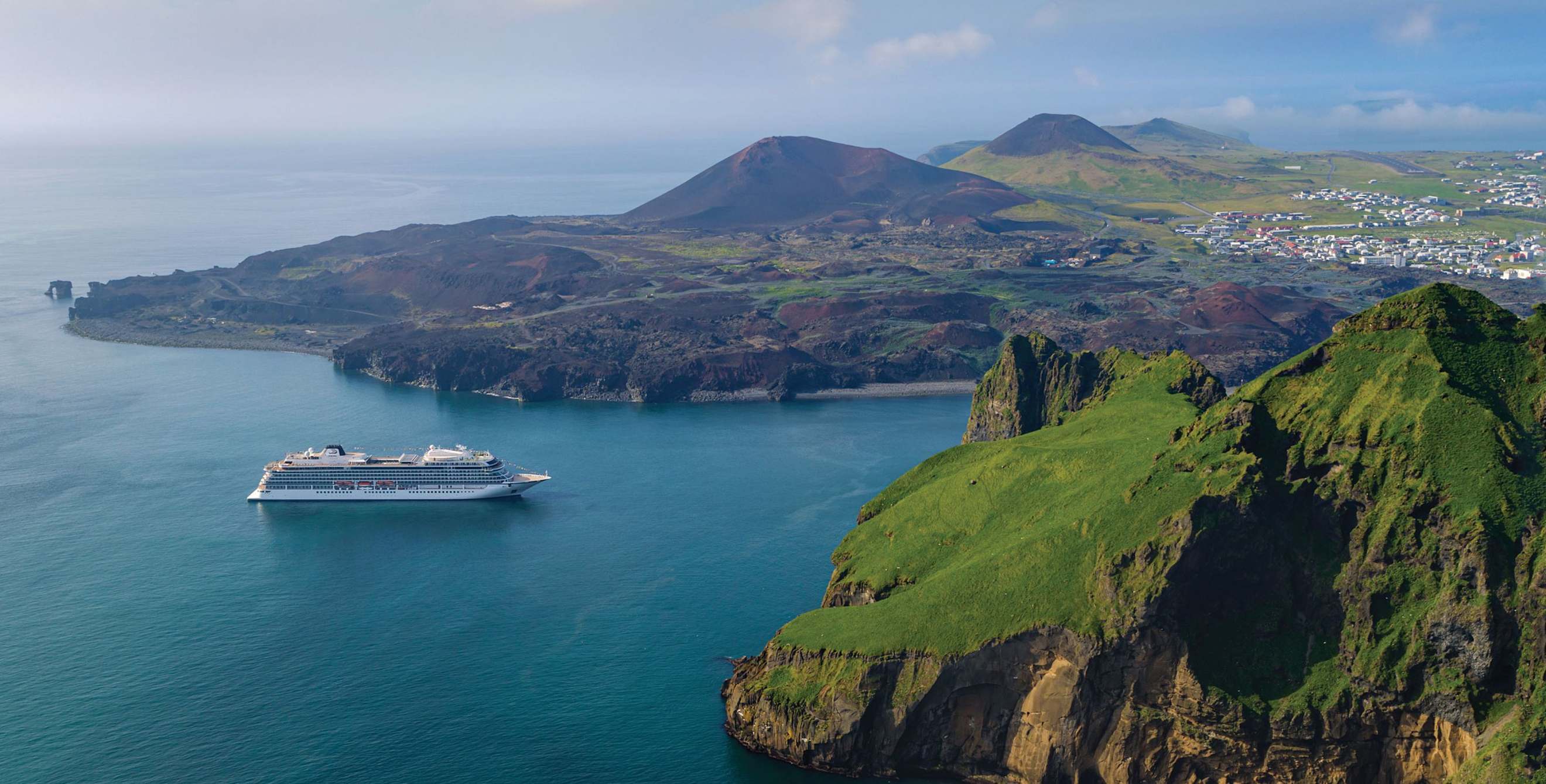 A Viking ocean cruise ship heads to port in Iceland.