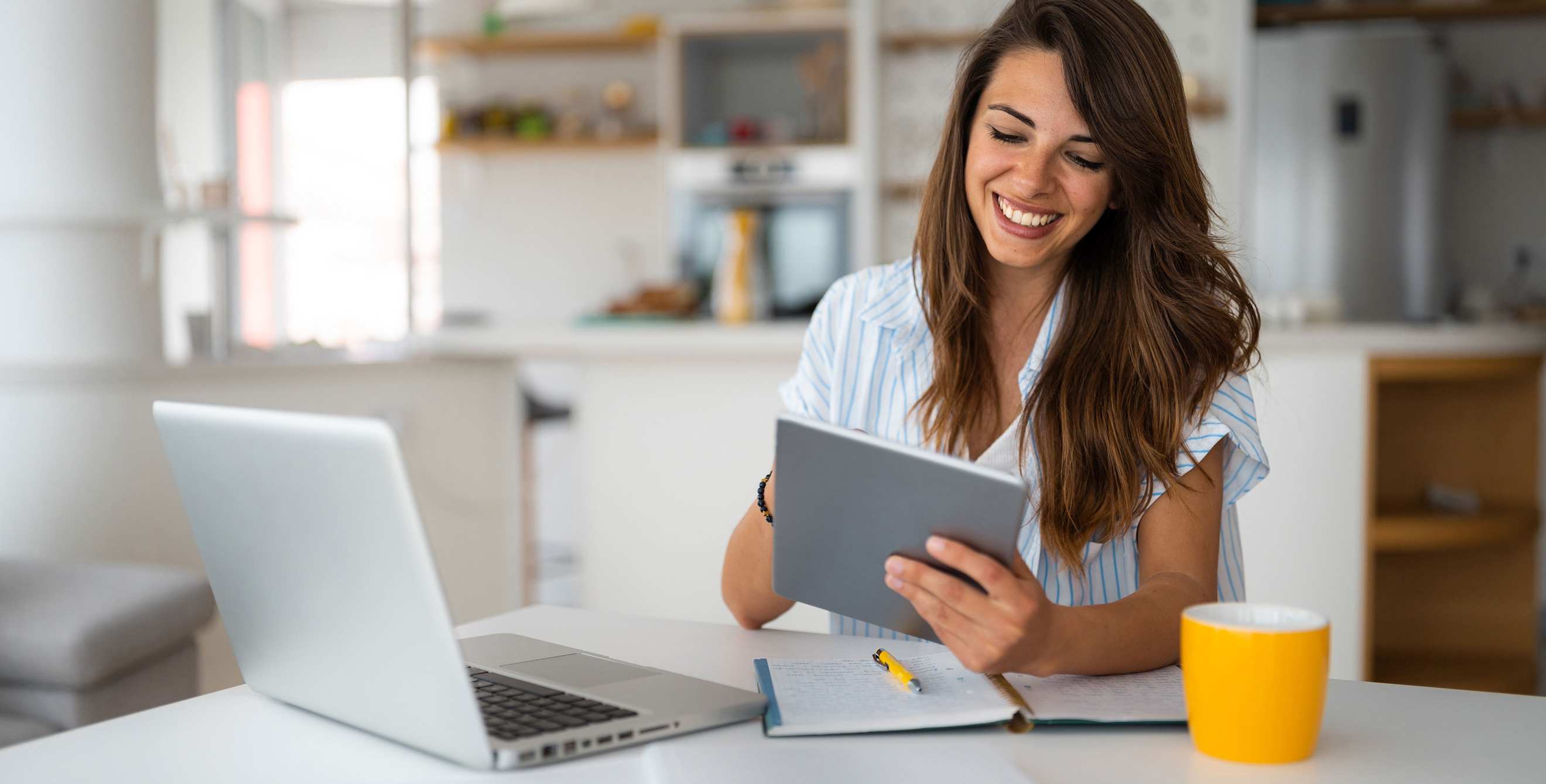 A woman looks at her 401(k) balance on her tablet.
