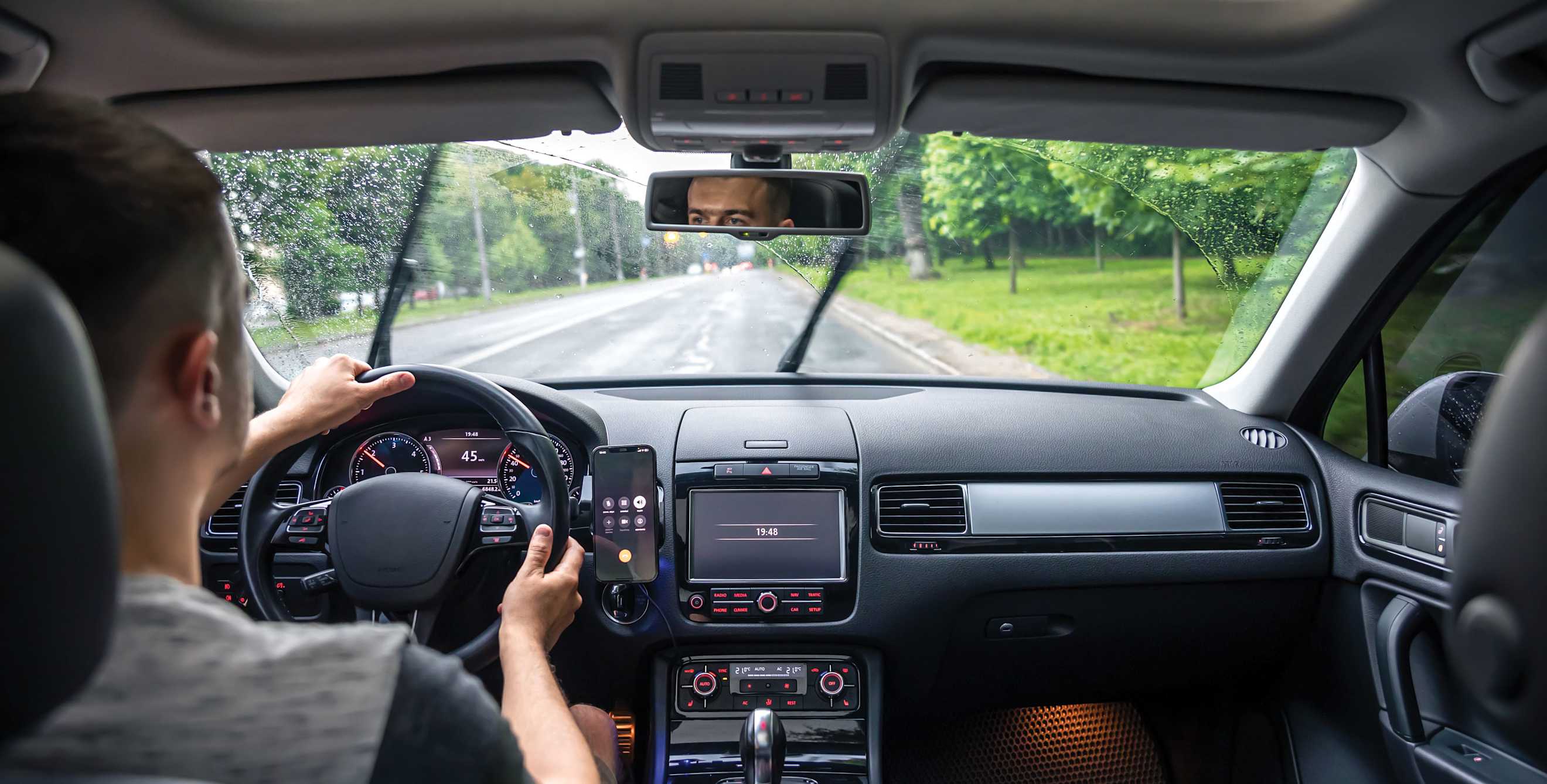 A driver practices driving safely in the rain