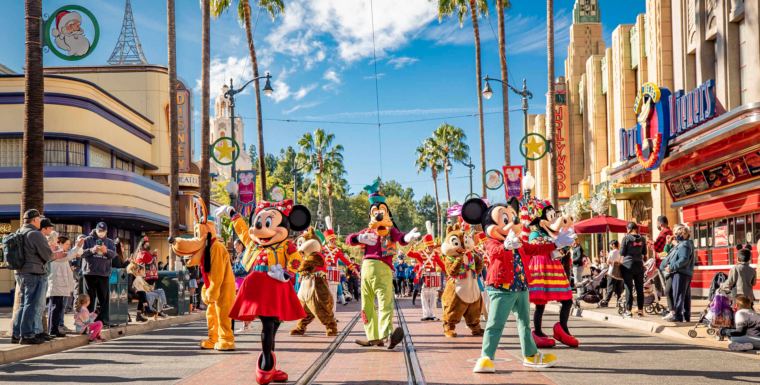 Mickey, Minnie, and Goofy dance in “Mickey’s Happy Holidays” during Disney Festival of Holidays at Disney California Adventure Park in Anaheim, California.