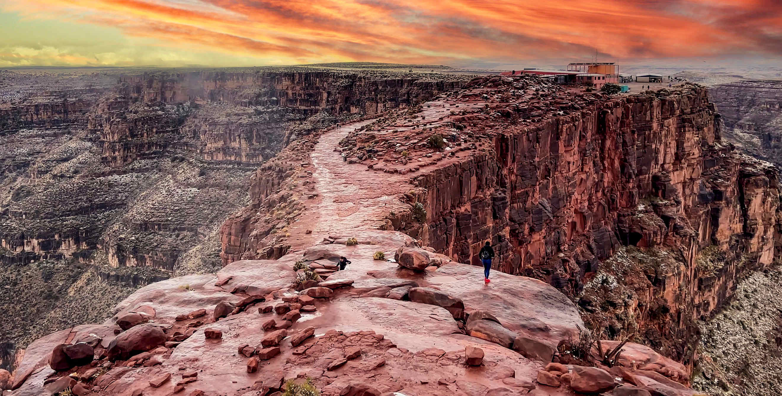 a red and orange sunset over the grand canyon