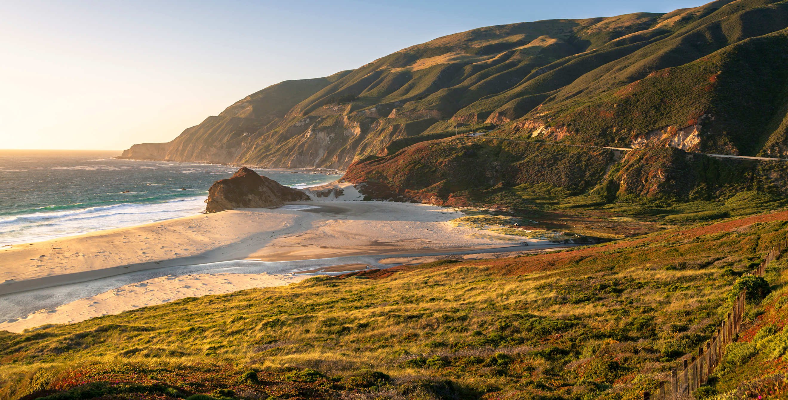 Big Sur river flowing out into the Pacific Ocean at Andrew Molera State Park in Big Sur, California.