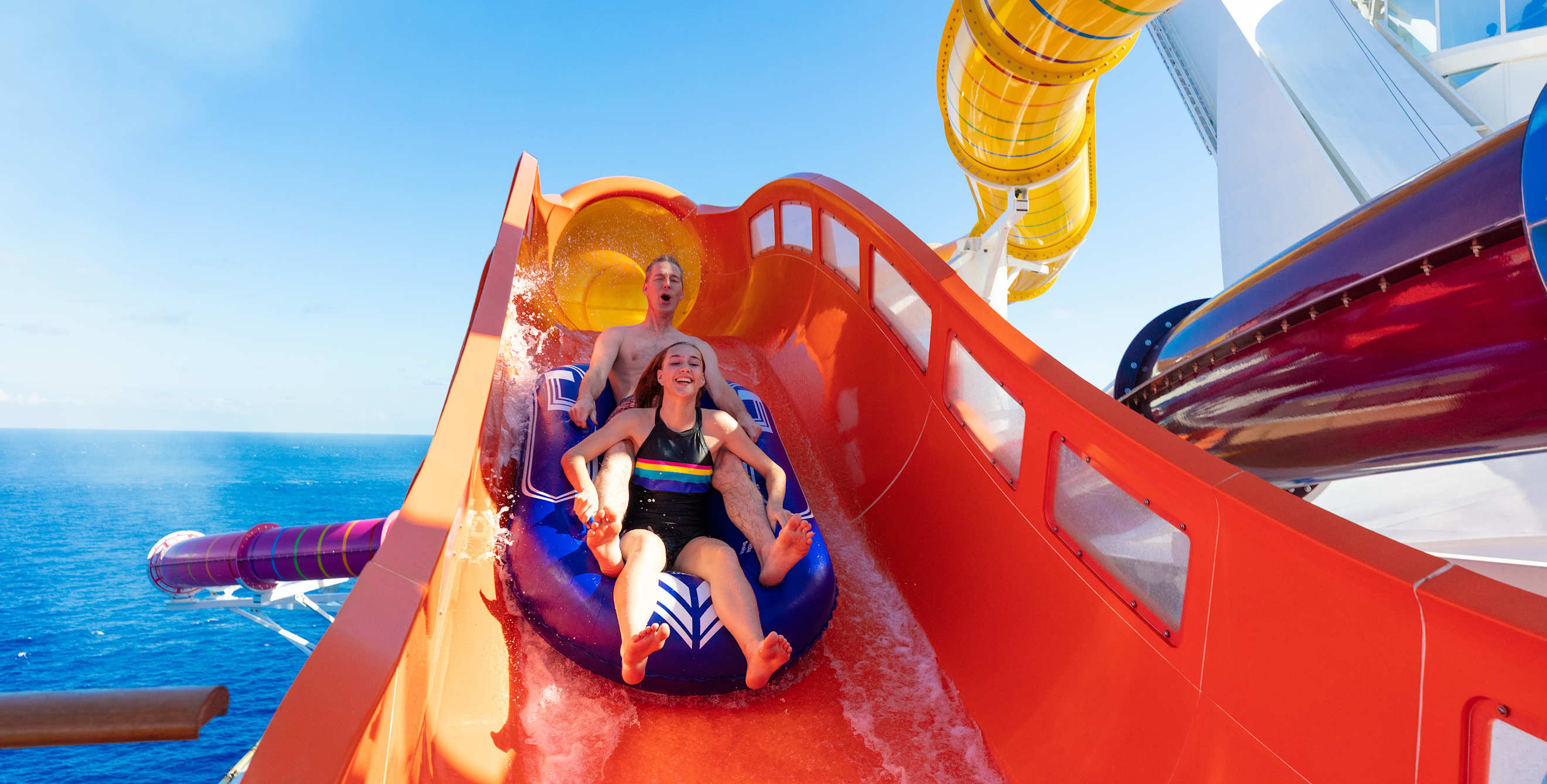 Father and daughter ride The Blaster on Royal Caribbean's Navigator of the Seas cruise ship.