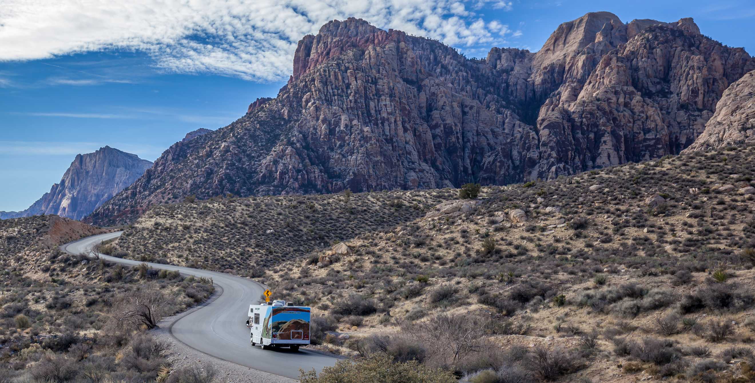 A family drive an RV into Red Rock Canyon National Conservation Area.