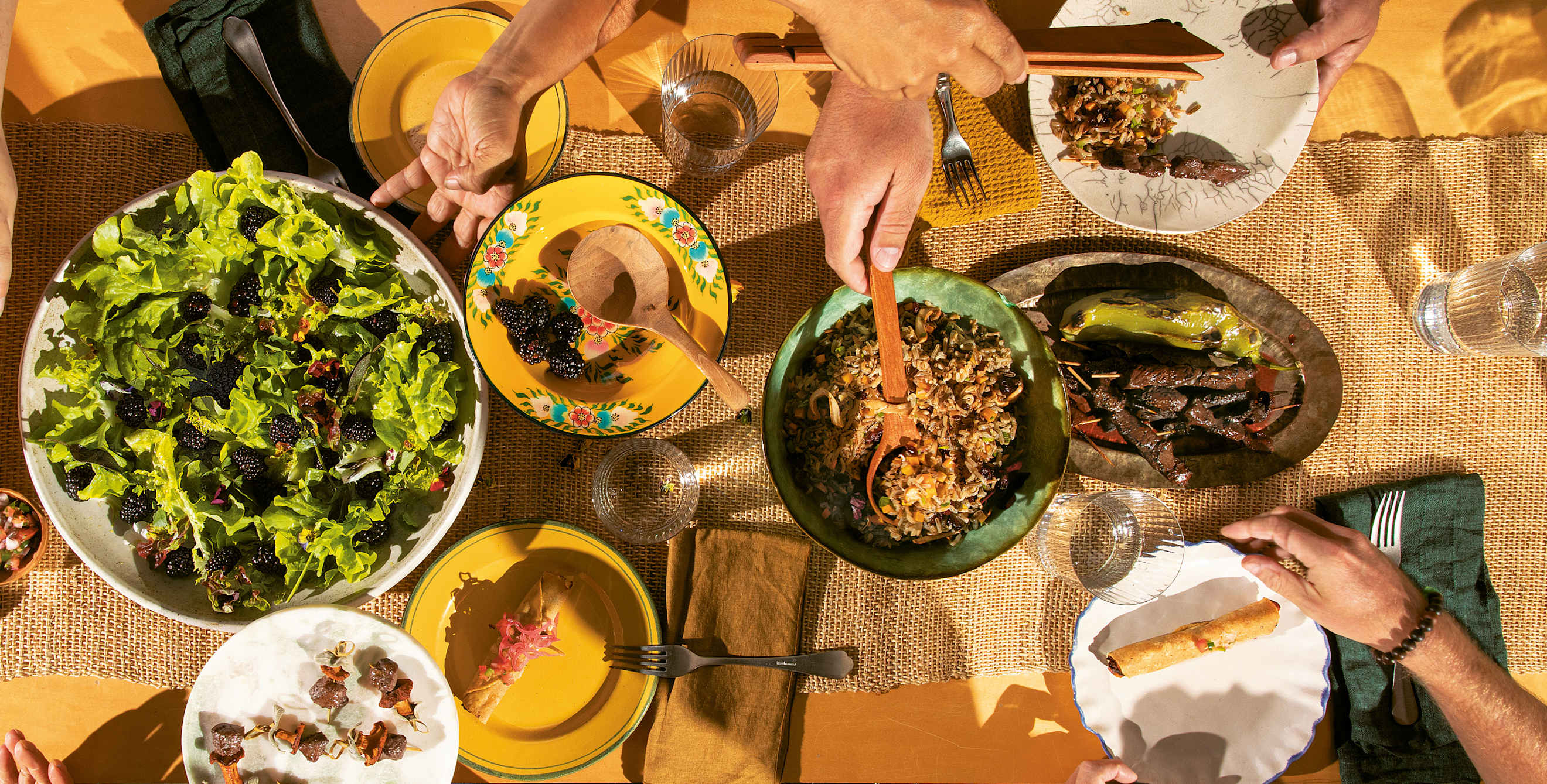 Beautiful dishes spread across a table from Wahpepah’s Kitchen in Oakland, California.