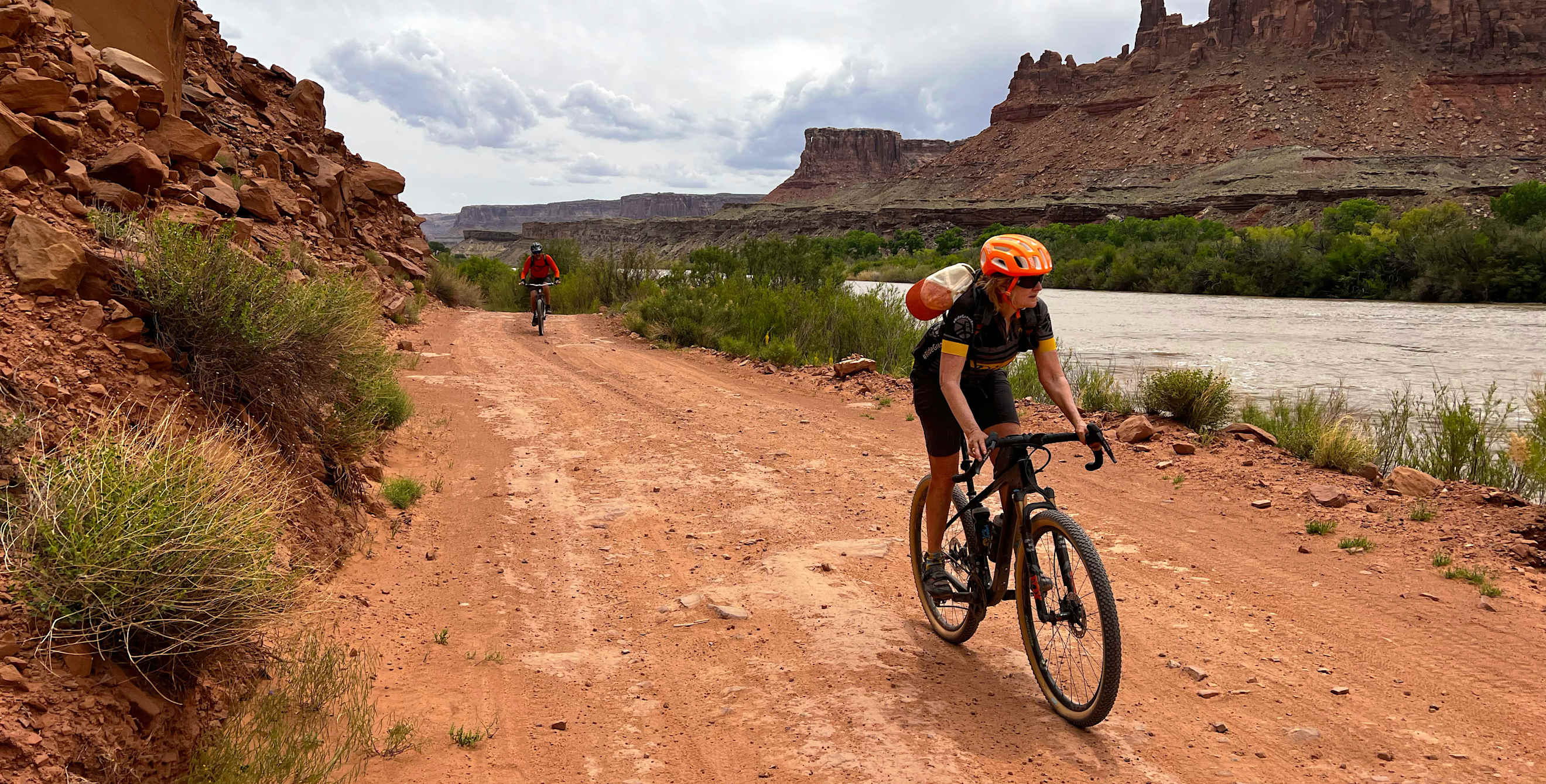 Two people ride gravel bikes on the White Rim trail near Moab, Utah.
