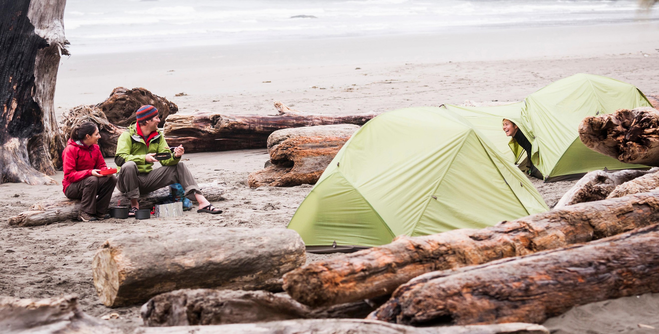 A group of friends camp on Second Beach in Olympic National Park, Washington.