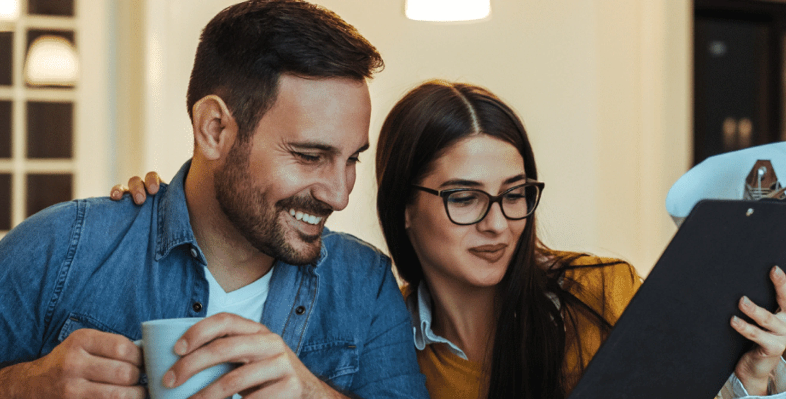 Couple looking at clipboard