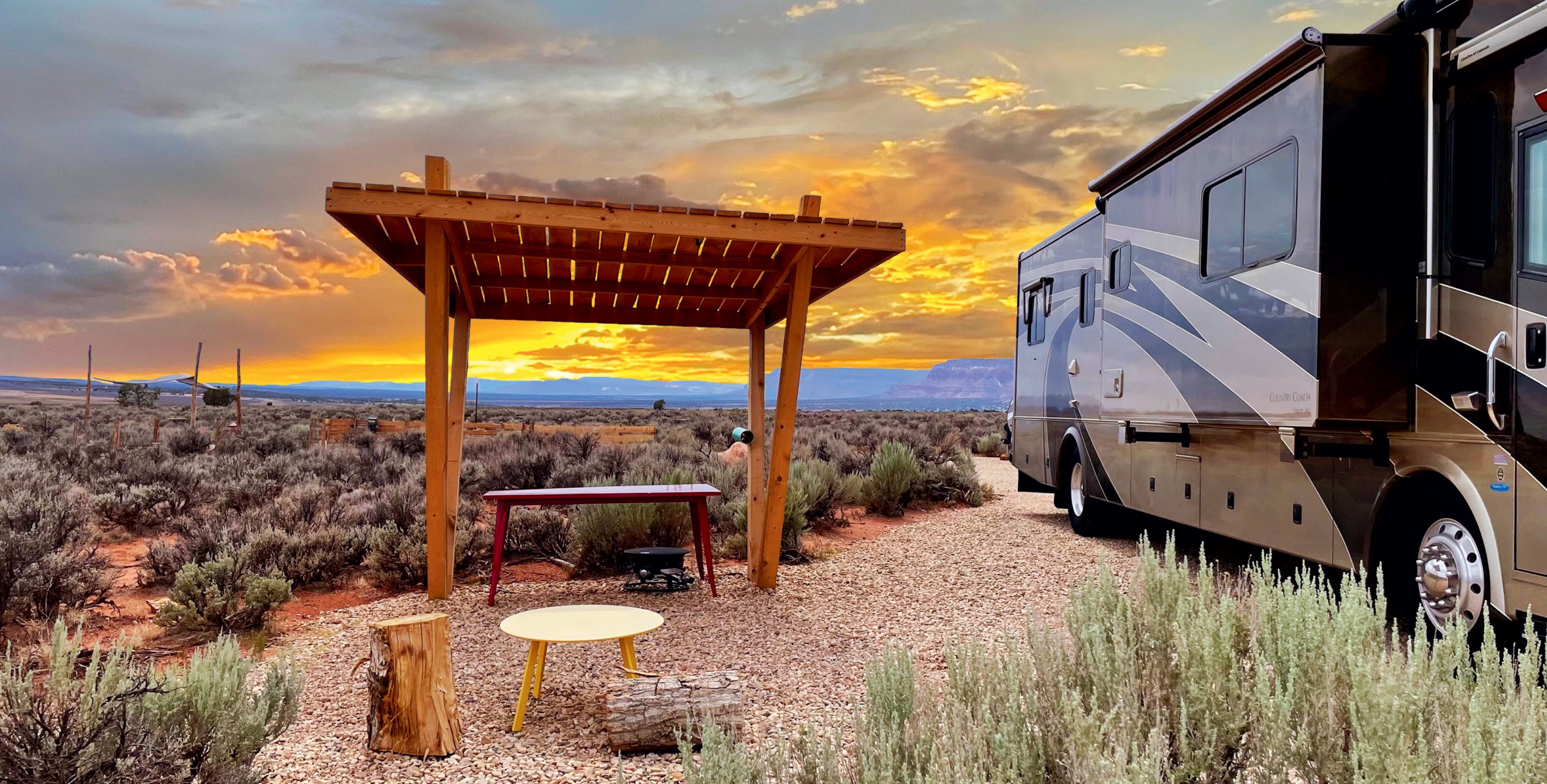 The sun sets behind a shade structure at Dark Sky RV Park and Campground in Kanab, Utah.