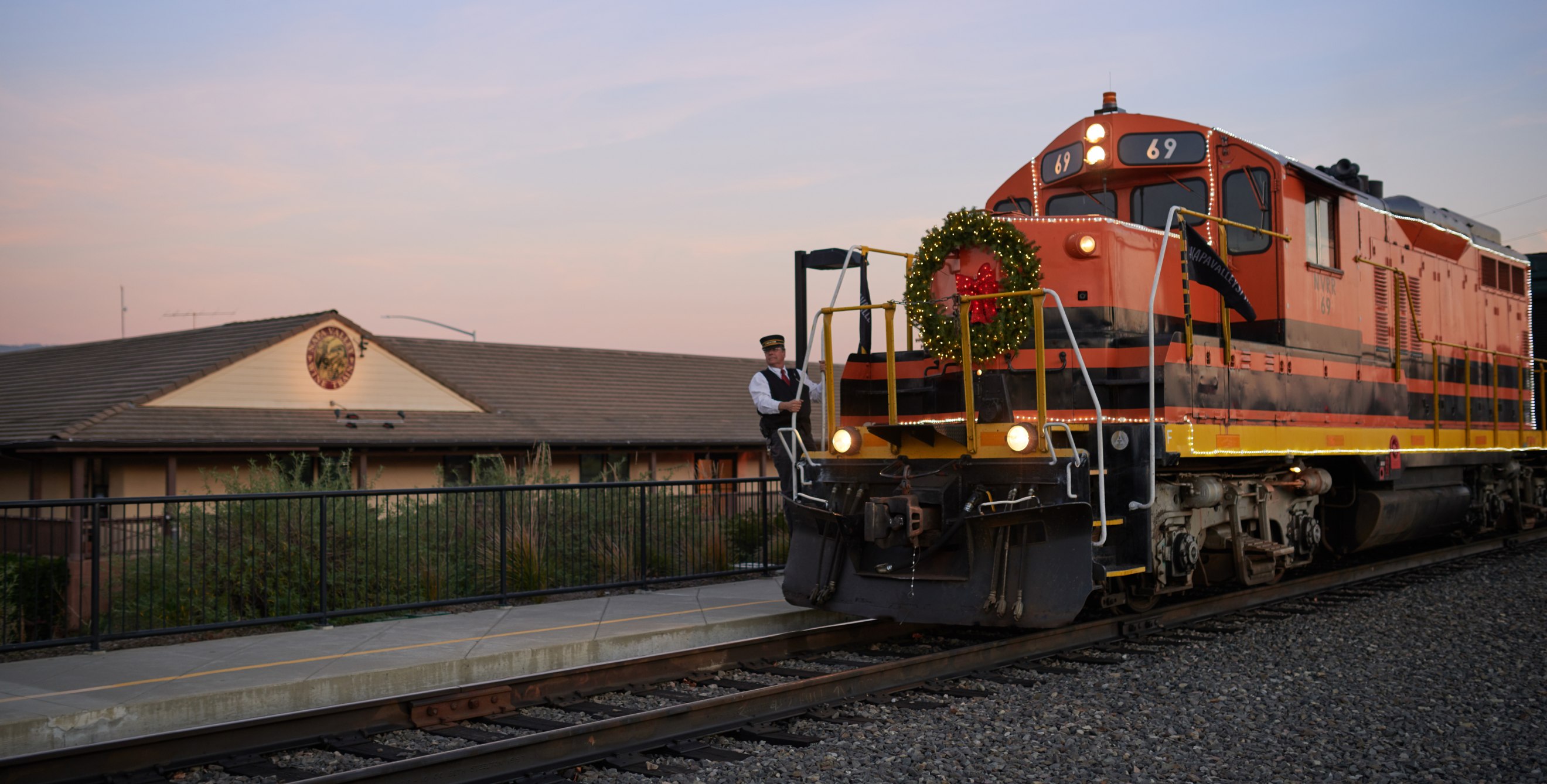 Napa Valley Wine Train's holiday train in Northern California at dusk.