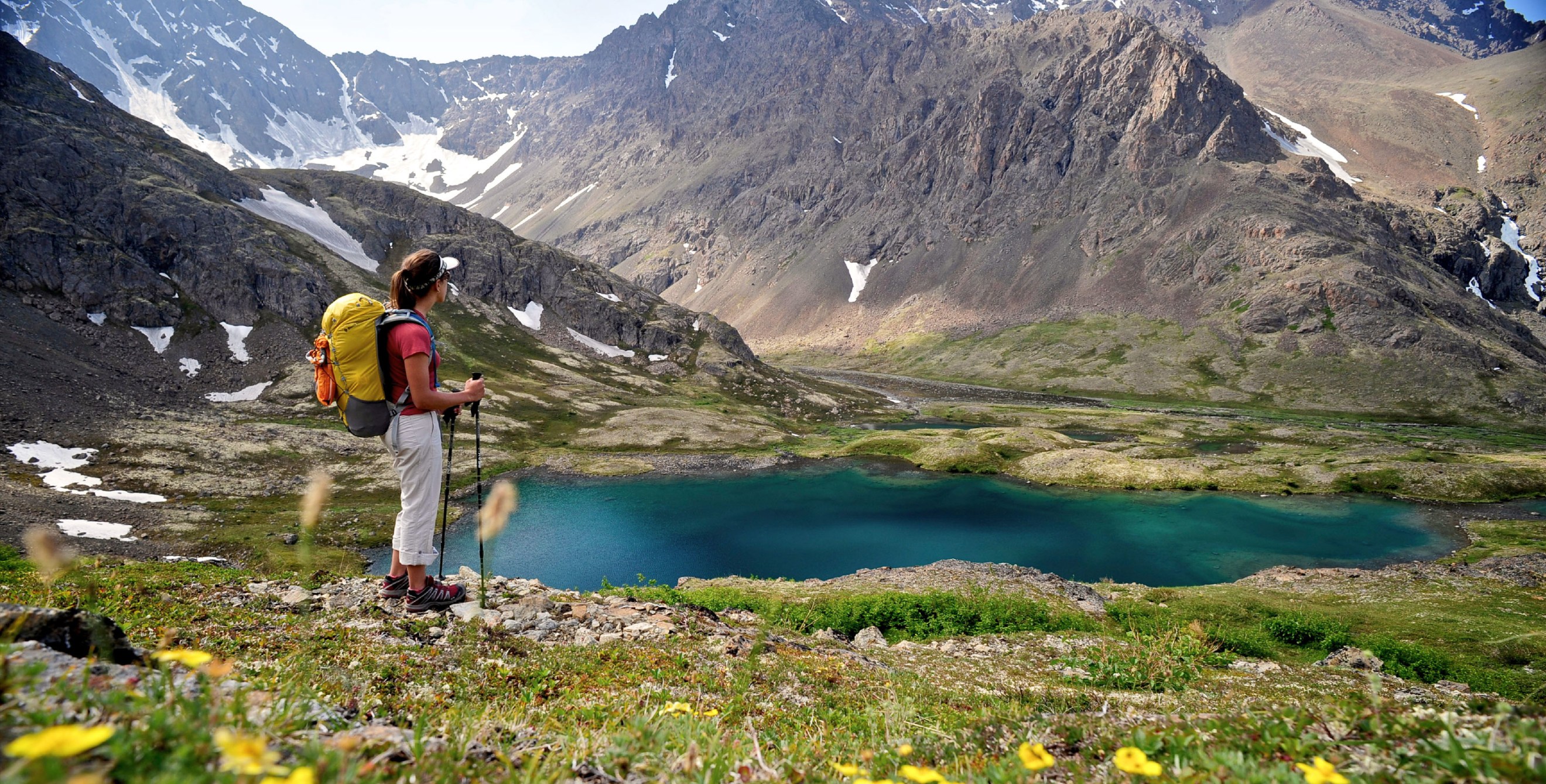 A hiker overlooks Williwaw Lakes in Chugach State Park, near Anchorage, Alaska, in summer.