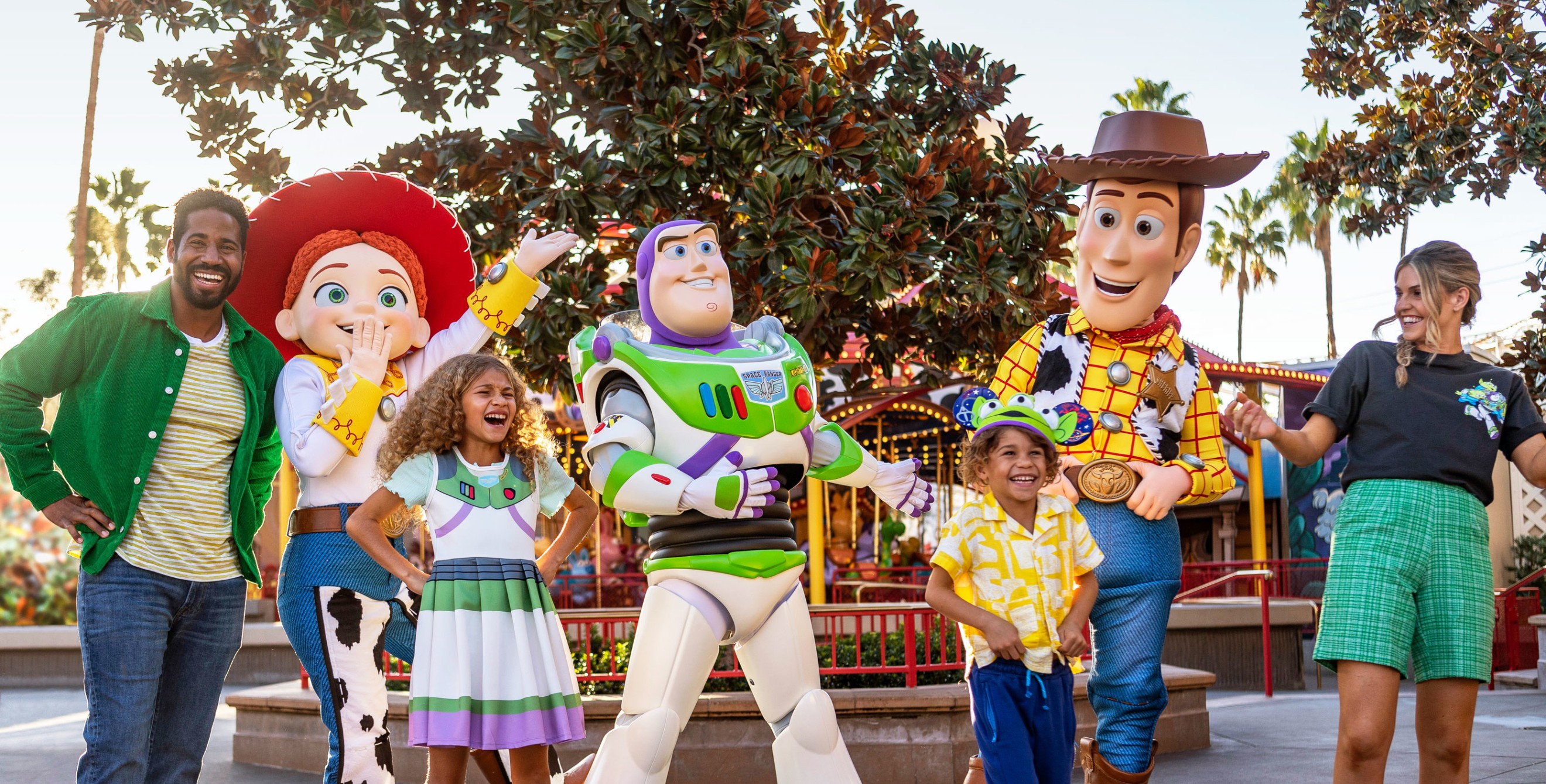 A family poses with characters from Toy Story at Disneyland Resort.