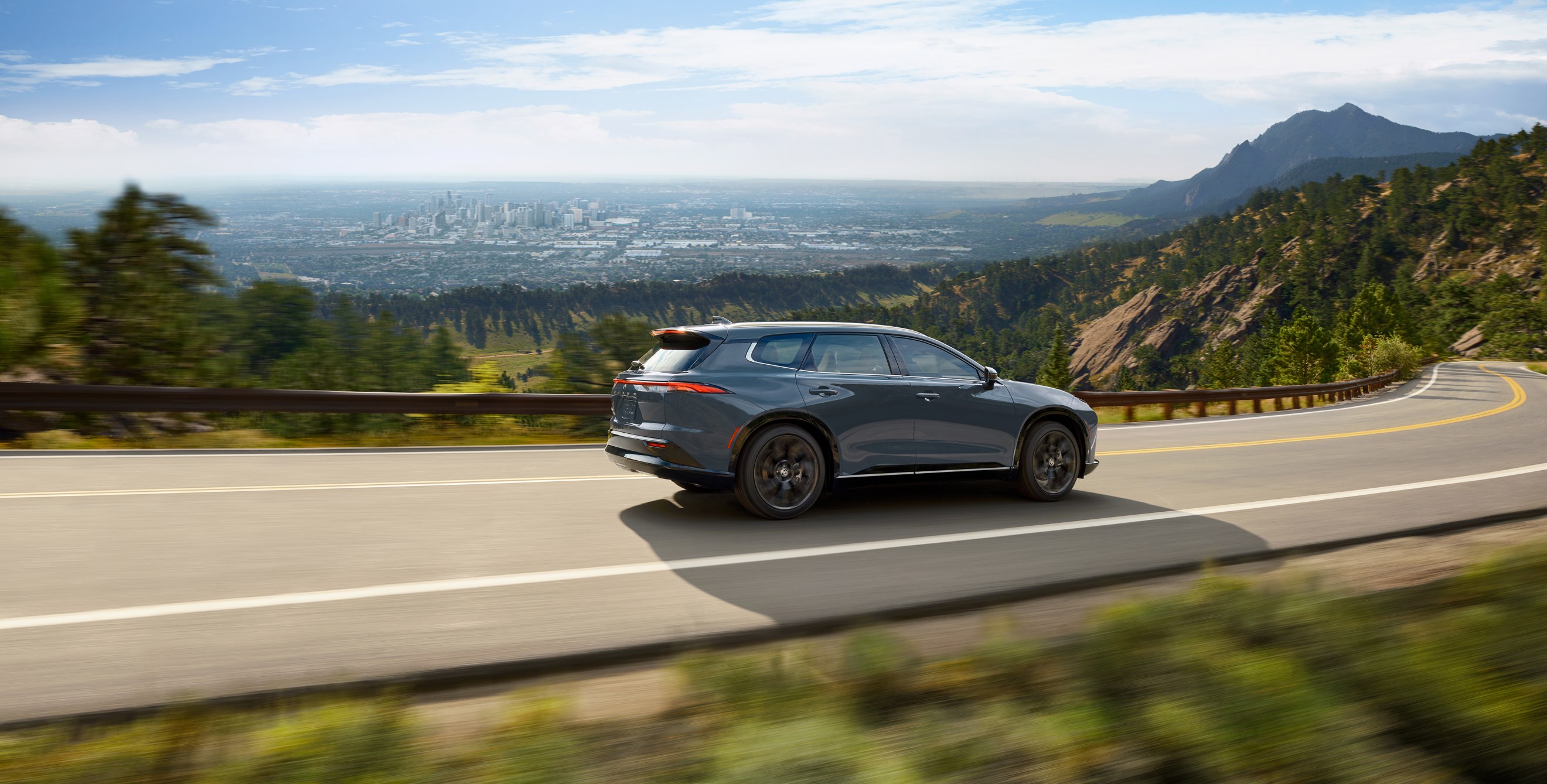 Toyota Crown Signia Hybrid on a hillside road.