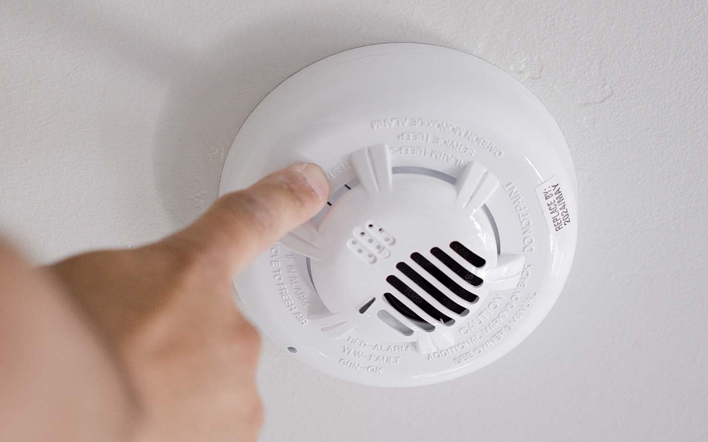 Hold the button down on the front of the Smart Carbon Monoxide Detector 