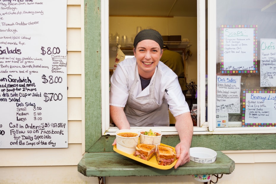 a person serving soups and a sandwich from a window at Antonette's Kitchen in Tillamook, Oregon, picture