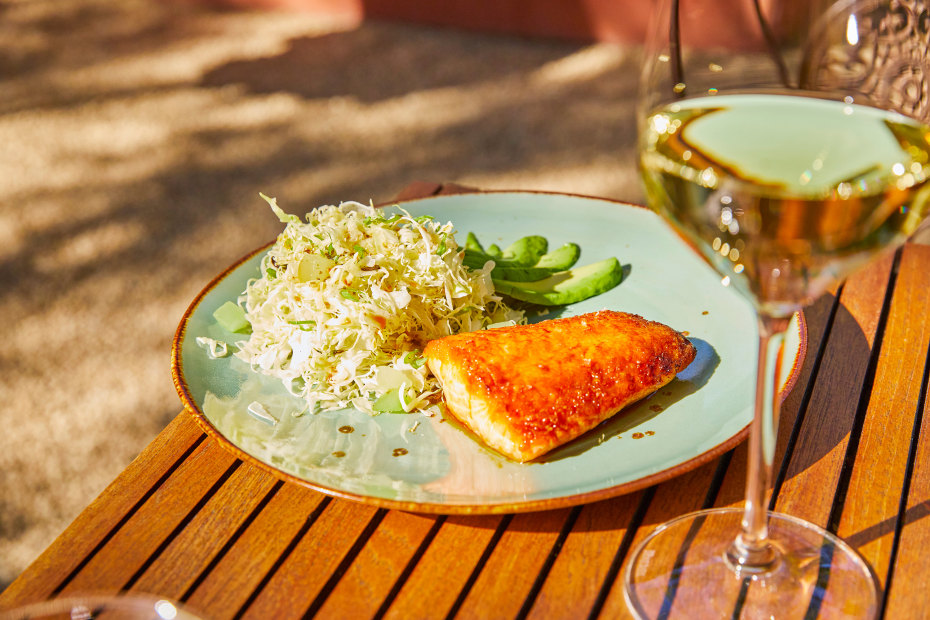 Barndiva's teriyaki glazed salmon on an outdoor table.