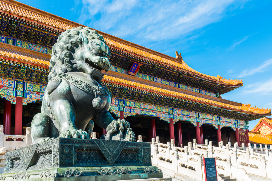 Bronze lion sits in front of the Hall of Supreme Harmony in Beijing's Forbidden City, in China, image