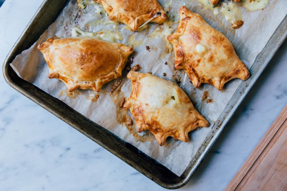 Jamon y queso empanadas from El Porteño SF on a baking tray at the Ferry Building on San Francisco's Embarcadero waterfront, image