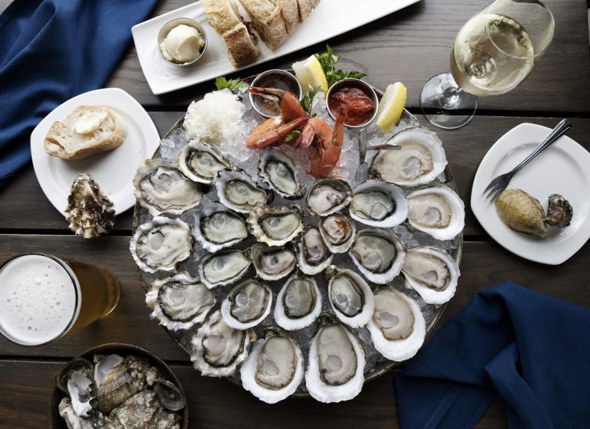 a tray of oysters on ice at Taylor Shellfish in Washington, picture