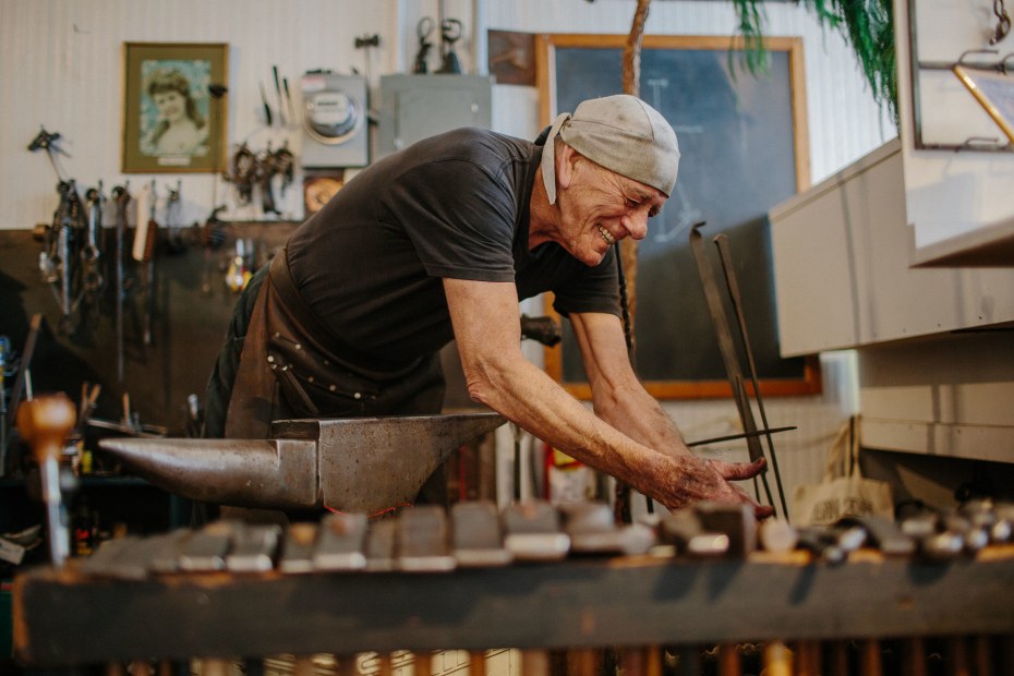 Joe Koches works with his coal-fired forge to create ironwork in his Blacksmith Shop on Main Street in Ferndale California near his gallery, picture