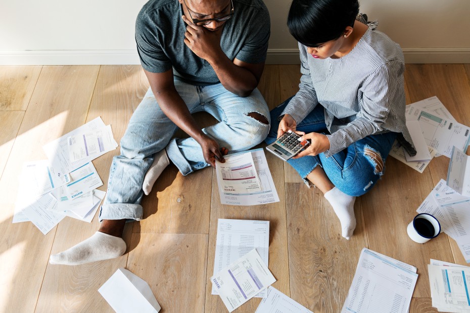 couple organizes household receipts and finances, picture