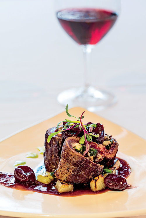 Montana elk and cherries served at Cafe Kandahar in Whitefish, picture