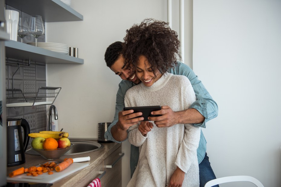 African American couple use tablet to control smart home, picture