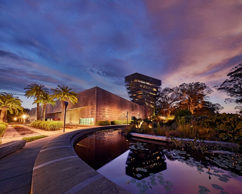 de Young Museum exterior at dusk in Golden Gate Park, San Francisco