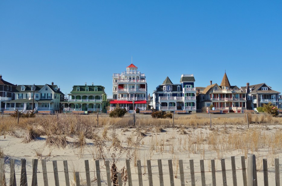 picture of the victorian houses lining the beach in cape may, new jersey