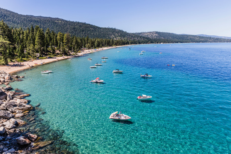 boats off the shore on the turquoise waters of Lake Tahoe