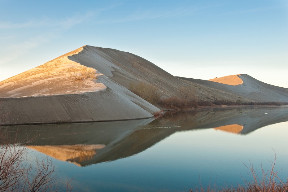 the dunes and a lake during the day at Bruneau Dunes State Park, picture