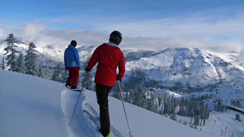 picture of two downhill skiers looking at the mountains in Bear Valley, California