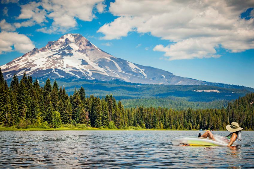 A woman floats on Trillium Lake in Oregon.