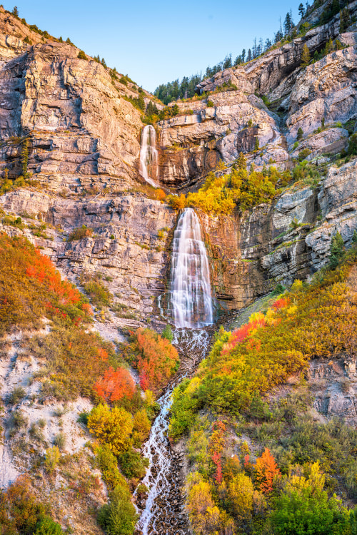 Provo Canyon's Bridal Veil Falls flanked by fall color.