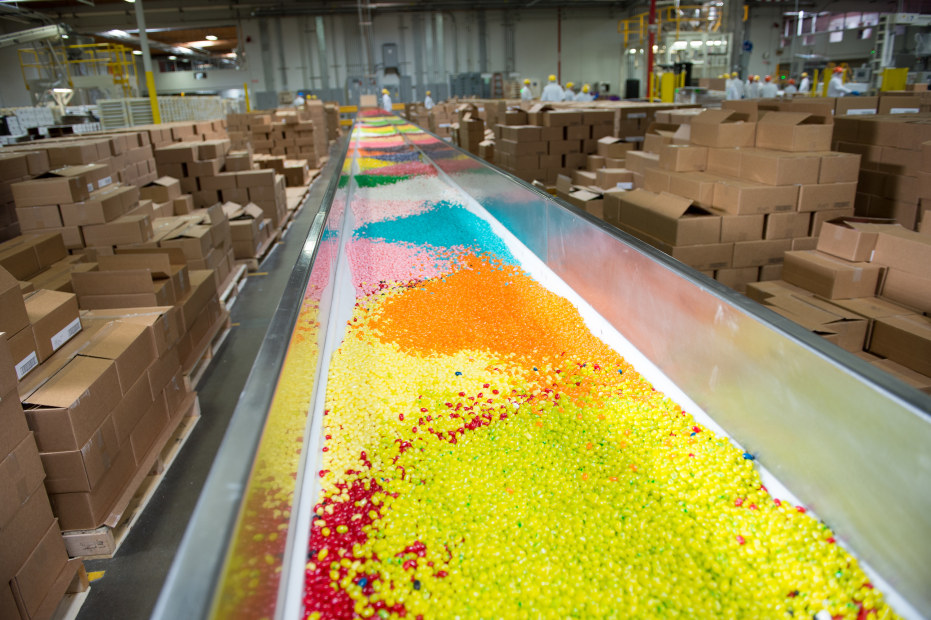 a rainbow assortment of jelly beans on a conveyor belt at the Jelly Belly Factory in Fairfield, California, picture