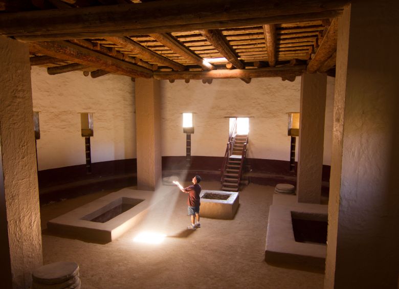 picture of a man standing inside a sunlit structure at the Aztec Ruins National Monument
