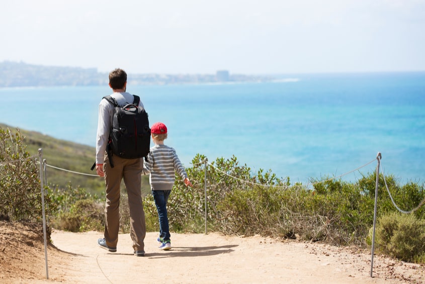 Father and son walking in Torrey Pines State Natural Reserve in San Diego, California, picture
