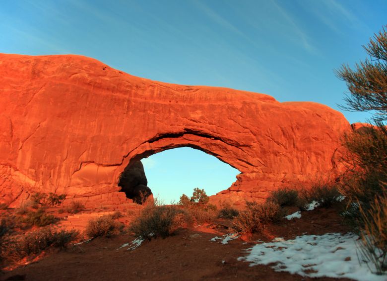 Red natural arch along the Dinosaur Diamond Scenic Byway, photo