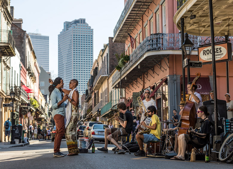 couple dances while buskers perform on Royal Street in New Orleans' French Quarter, picture