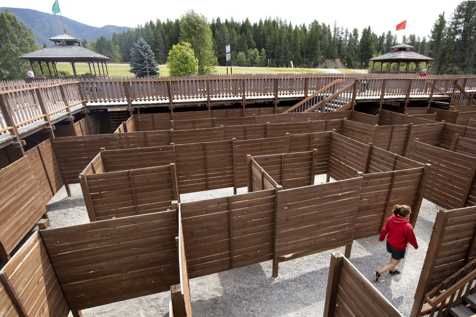 A girl walks the giant maze at Coram's Amazing Fun Center.