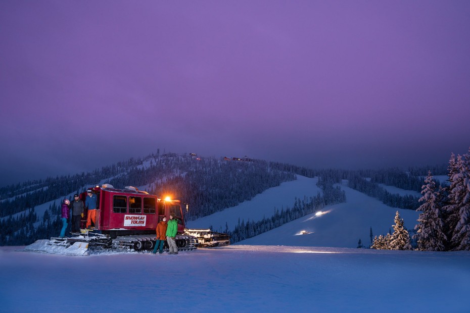 Riders stand in front of the Snowcat at Winter Park Resort in Colorado, image