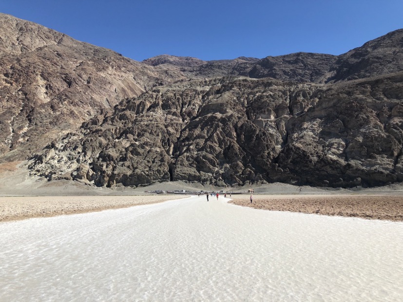 picture of the salt flats in the Death Valley National Park's Badwater Basin with people walking