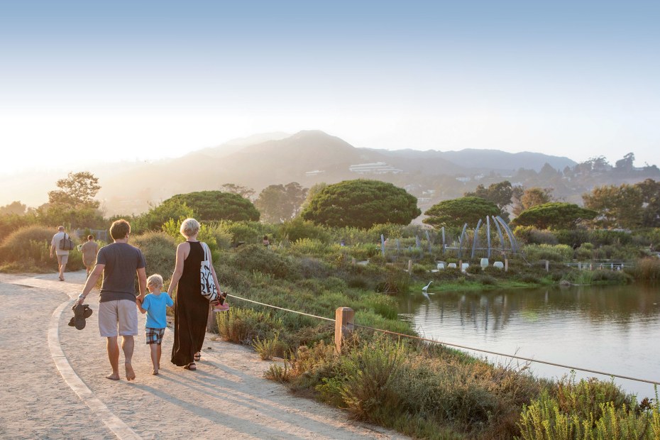 Family walking along Malibu Lagoon, photo