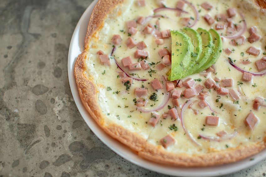 quesadilla alternative with creamy Mexican cheese, italian sausage, and avocado slices at Roland's Cafe Market Bar in Phoenix, picture