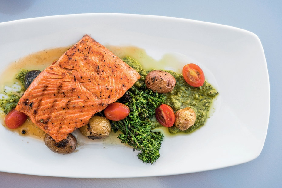 salmon is with vegetables and piquant salsa verde at WildFin in Vancouver, Washington, picture